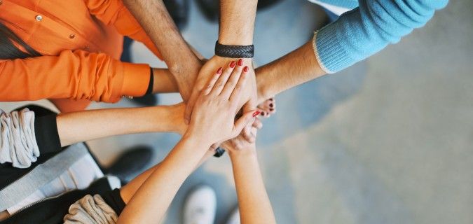 What are ways businesses can get involved in their communities?
