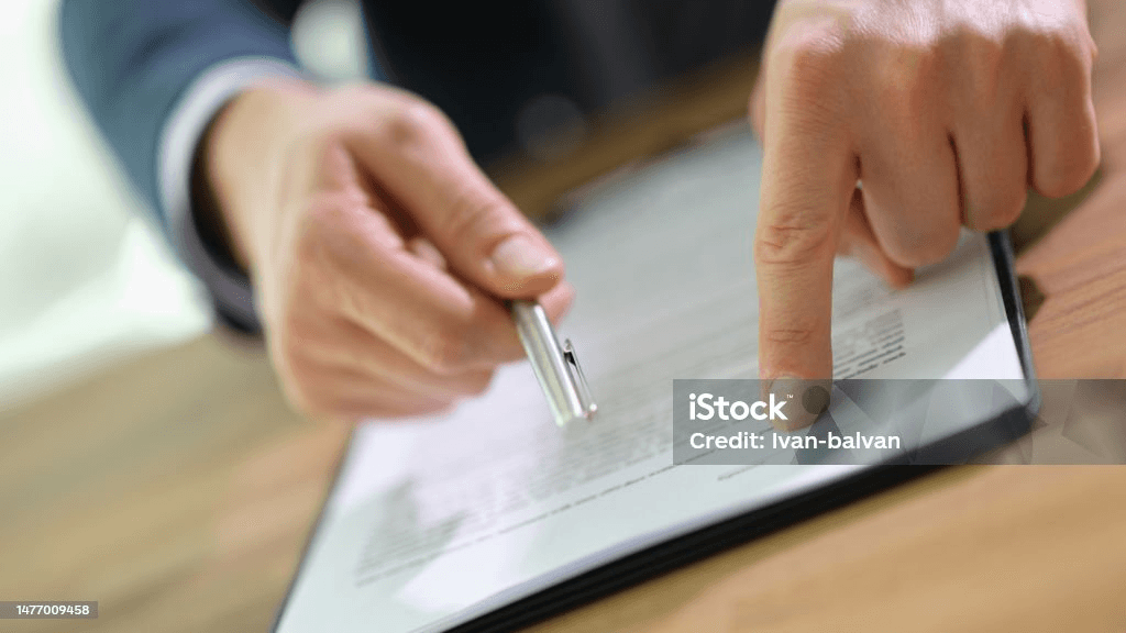 man pointing to document.png 
